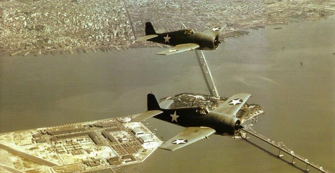 Color shot of some early F6F-3's over San Diego