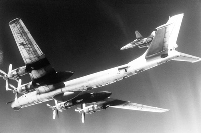 Underside of a TU-95D being intercepted by a F-14A