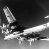 Underside of a TU-95D being intercepted by a F-14A