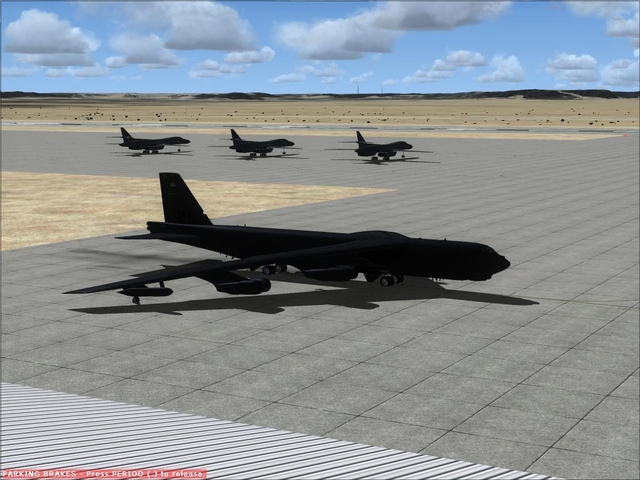 B-52H(late) at Dyess AFB with B-1B's in parking.JPG