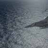 F-15J Banking Around Wounded Civilian Cargo Ship