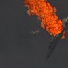 F-15J Racing Past Shot Down Su-22 Fencer